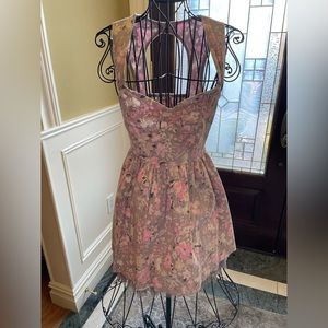 Adorable fun & feminine short dress w/ open back detail.